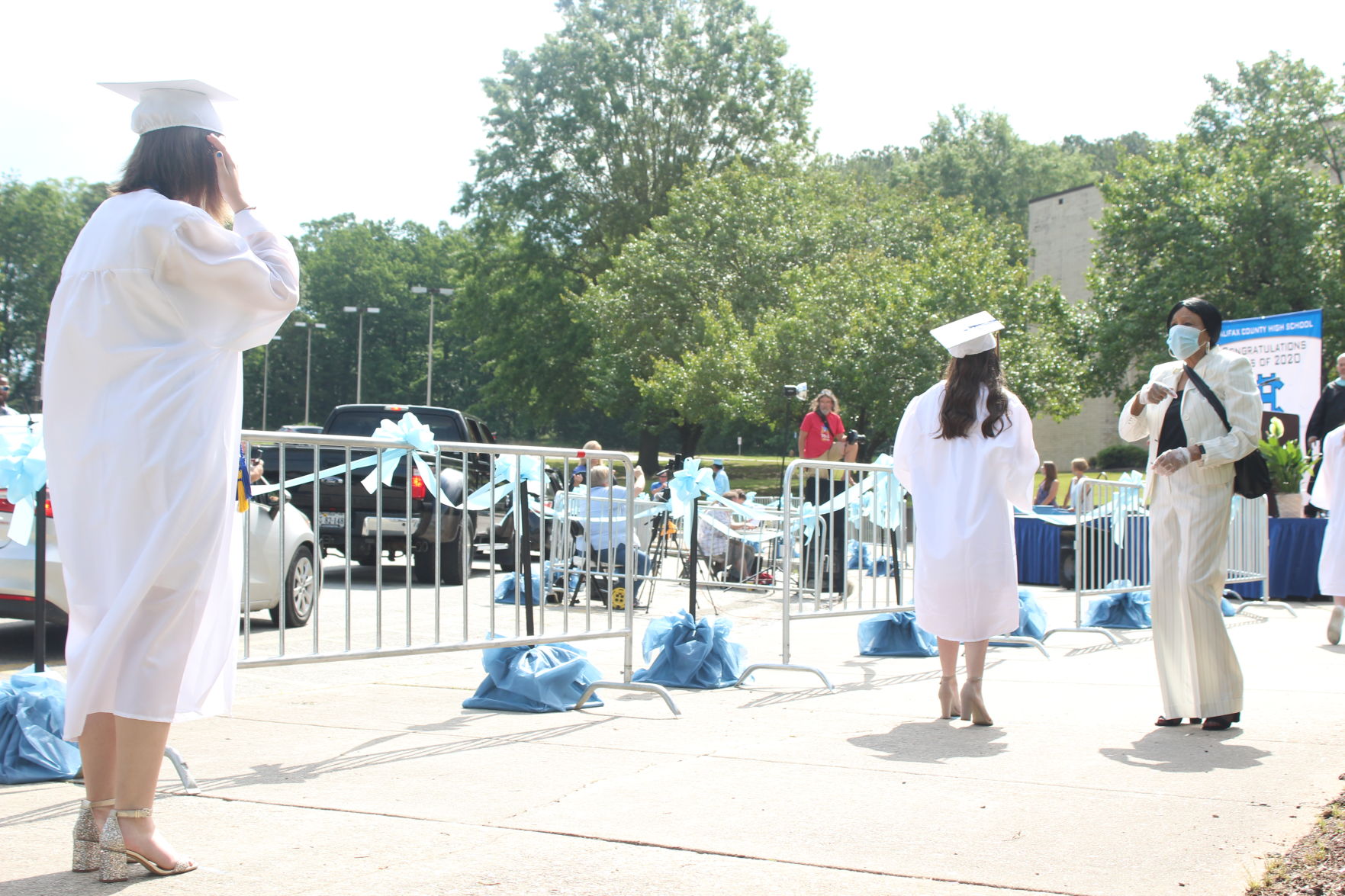 Harriett Claiborne helps graduates.JPG